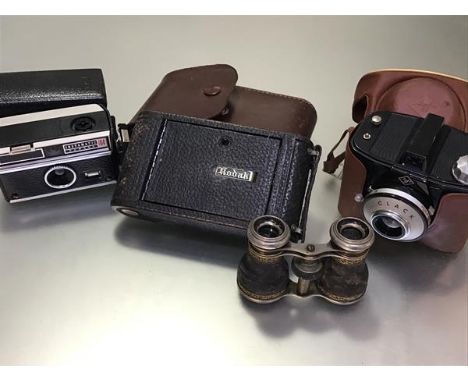 A Kodak folding camera complete with original case, an Agfa Clack German camera, a pair of opera glasses and a Kodak Instamat