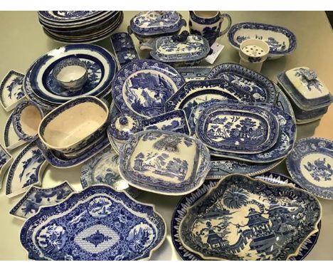 A large collection of 19thc English blue and white transfer printed country house ashets, tureens, jugs, saucers and serving 