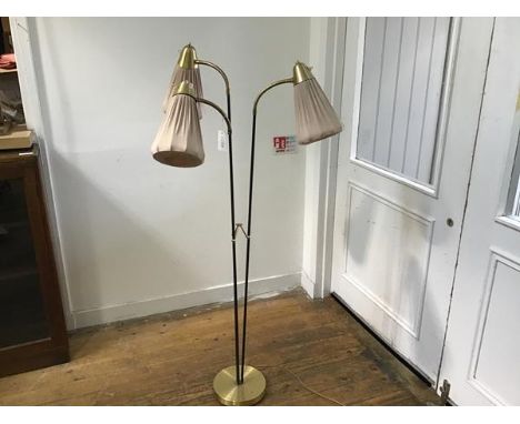 A 1950s Armature Hantverk of Gothenberg anodised black and metal triple branch floor lamp, with brass adjustable necks, raise