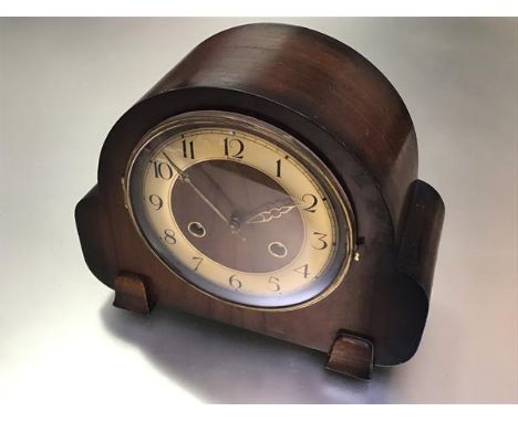A vintage Deco walnut chiming mantle clock with silvered dial, twin key apertures and arabic numerals (h.22cm x 26cm x 10cm)