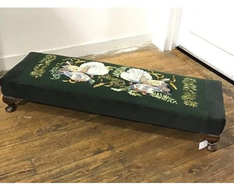 A 1930s mahogany framed fender stool with tapestry fan tail dove and woodpigeon embroidered panel, raised on carved moulded s