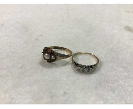 A yellow metal diamond illusion set three stone ring and a yellow metal 9ct gem set ring (2.6g)
