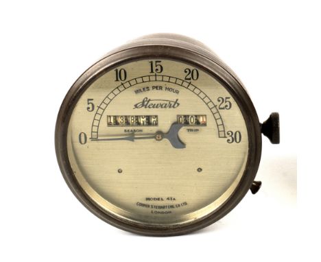 A Stewart Model 41A 30mph speedometer and an oiler,the speedometer with brass casing, brushed dial with season and trip windo