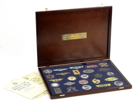 A cased set of 'Badges of the World's Great Motor Cars' by Danbury Mint,25 motor car silver-plated and gold-plated enamelled 