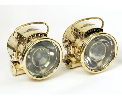 A fine pair of Bleriot Model 303 self-generating acetylene headlamps, French, circa 1904,each stirrup mounted polished brass 