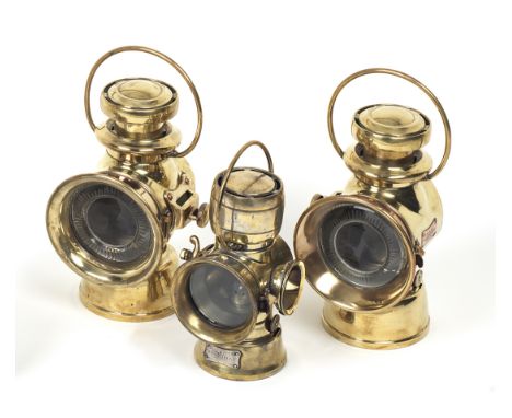 A pair of Lucas No.754 oil-illuminating sidelamps and a Lucas No.635 number plate lamp,the sidelamps with polished brass bodi