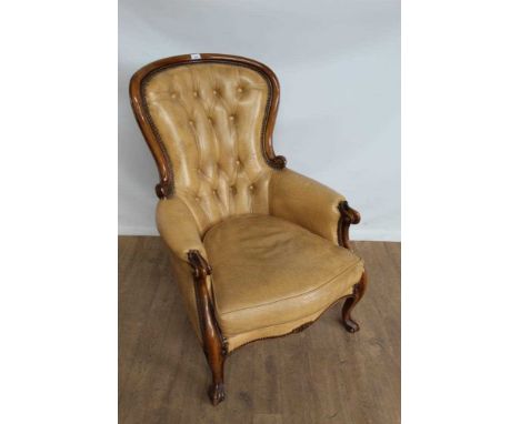 Victorian-style buttoned leather upholstered armchair on carved scroll supportsIt is light tan. No splits to the leather, it 