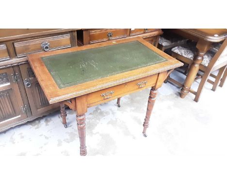 Edwardian walnut writing table with inset green leather lined top, single drawer below on ring turned legs, 89cm wide, 50.5cm