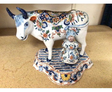 Dutch Delft model of a cow and milkmaid, polychrome painted, AK monogram to base for Adrianus Kocks