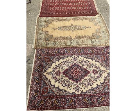 Bokhara carpet 180cm x 128cm, Kashmir carpet 190cm 125cm and a Kashmir carpet 180cm x 130cm (3)