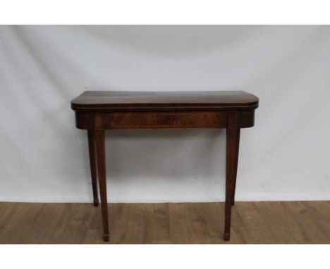 George III mahogany D-shaped card table, with crossbanded hinged top enclosing baize lined playing surface on square tapered 