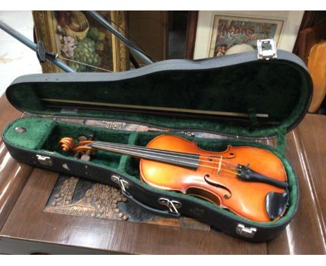 Violin and bow with 'Copy of Stradivarius' label, in hard case