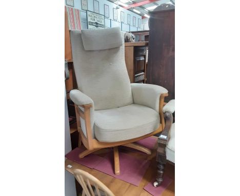 Ercol swivel chair and matching stool (2)