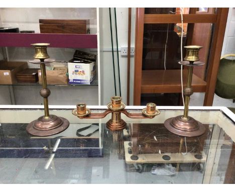 Pair of Benson style copper and brass candlesticks, and another three branch candlestick (3)