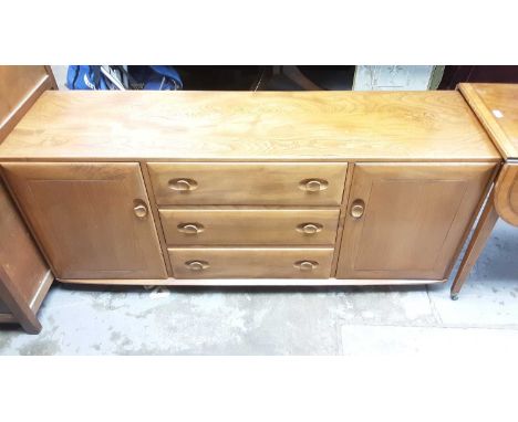 Ercol sideboard with three central drawers flanked by cupboards, 155cm wide, 43cm deep, 69cm high