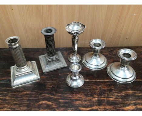 Two pairs of silver candlesticks, one other small silver candlestick and silver spill vase