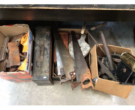 Collection of old tools, including saws, planes, etc
