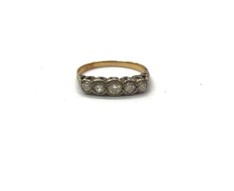 18ct gold diamond five stone ring in platinum rub over setting, size PWeight 2.5 grams 