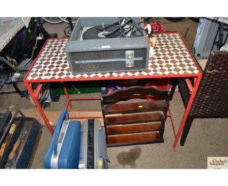 A tile topped metal framed side table