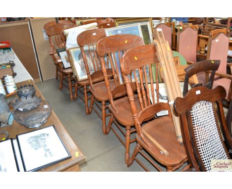 A set of six stick back dining chairs to include two carvers