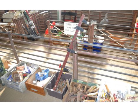 A box of spanners and a single sash cramp