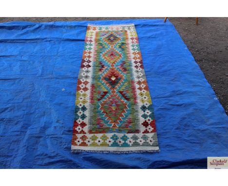 An approx 6'5" x 2' vegetable dye Chobi Kelim runner