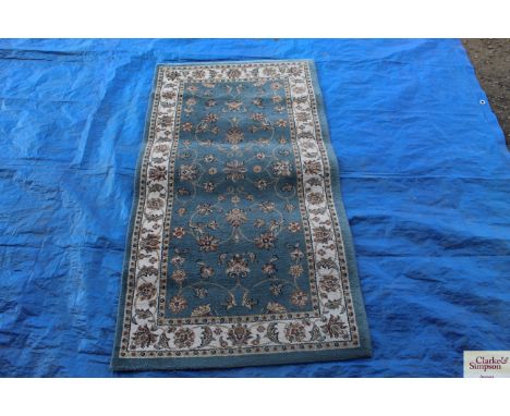An approx 4'9" x 2'6" floral patterned runner