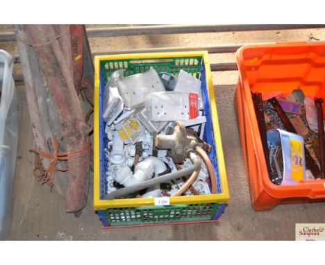 A box containing various light switches, pipe fittings etc. 