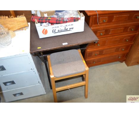 A folding card table together with a beech stool