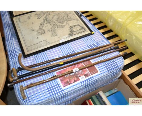 A quantity of various sticks to include a silver capped swagger stick, a silver collared and horn handled walking stick etc.