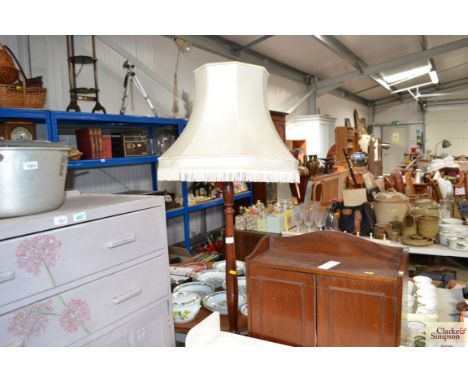 A mahogany standard lamp and shade