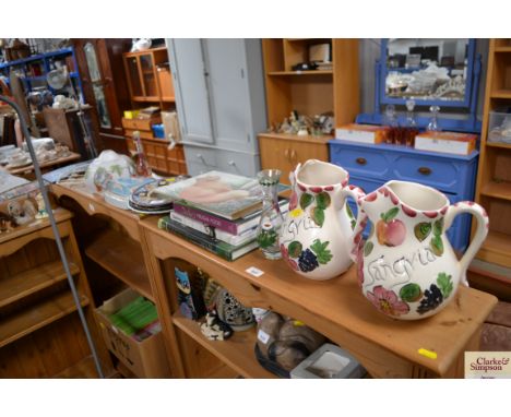 A pair of floral decorated jugs; a quantity of books; glass light shade etc