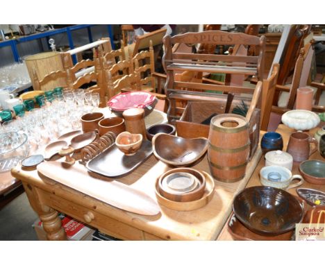 A large quantity of various wooden items to include spice rack, bowls, toast rack, serving dishes etc.