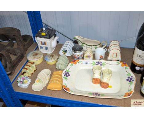 A quantity of various china to include a toast rack; jars and cover; novelty teapot; Royal Worcester egg coddler etc