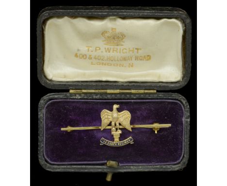 An Essex Regiment Sweetheart Brooch. A fine Regimental Brooch in 9 carat gold, 50mm x 15mm, regimental eagle resting on ename