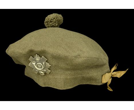 A Highland Light Infantry Tam O’Shanter. A scarce named other ranks Great War period Tam O’Shanter, complete with cap badge, 