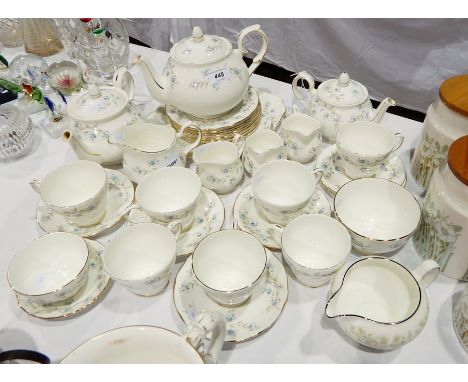 Wedgwood porcelain part tea service including one large and two smaller teapots, various cups, saucers and plates, two cream 