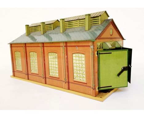 A Hornby 'O' gauge E2E engine shed with double track with printed green double doors 