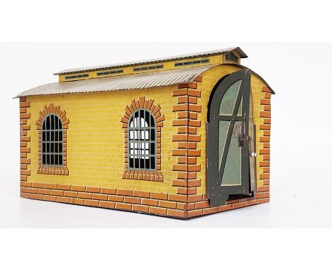 A Bing single road engine shed, brick-effect with two windows to each side, printed arched double doors and corrugated effect