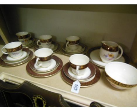Staffordshire Porcelain Gilt Decorated Tea Service on Burgundy Ground