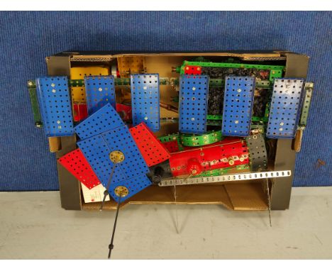 Meccano model of a red and green steam train and carriage. 