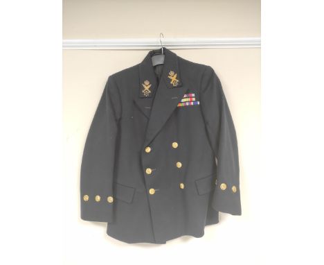 British Royal Navy uniform, a black jacket having Buttons Ltd of Birmingham naval brass buttons, bullion wire crossed torpedo