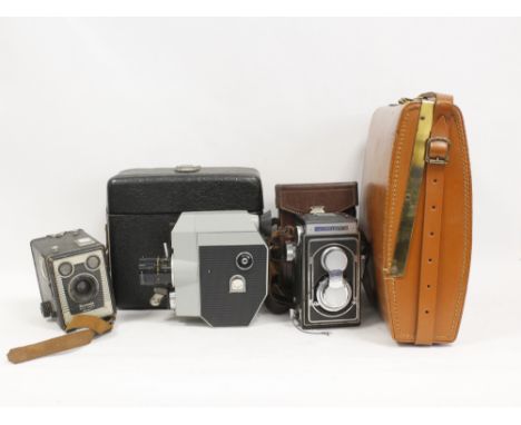 Four cameras to include a Zeiss Ikoflex II with lens cap and carrycase and a Polaroid Electric eye 850 with carry case and fl