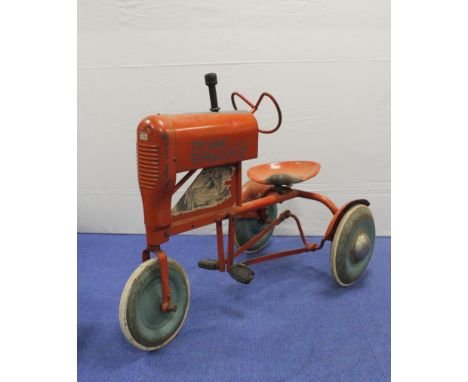 Vintage Triang Major tractor peddle car in red oxide paint with applied engine decals to the side. Play worn with surface rus