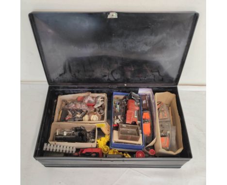 Collection of vintage toys in japanned metal box to include small model trains and a collection of lead animals and policemen