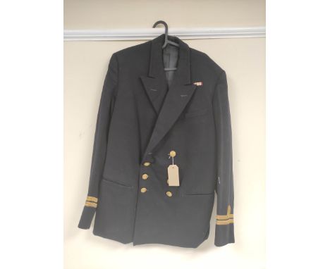 British Royal Navy uniform, a black jacket with Goode's (Portsmouth) Ltd label "MR WOYKA RNVR 25th JUNE 1956? or 1986?" havin