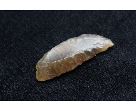 Neolithic- Danish flint sickle of crescent form constructed from faceted amber flint. The implement was found in Ulbjerg, Jut