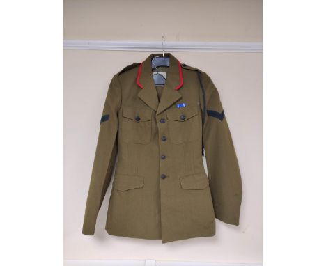 British Army uniform, an olive green jacket with H Edgard and Sons Ltd label "MES BDR LIMBU 668319 D COY" having black crosse