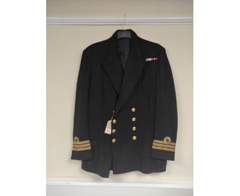 British Royal Navy uniform, a black jacket with Gieves of London label "13603 15-5-56" having Gieves Ltd naval brass buttons,