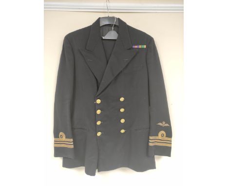 British Royal Navy uniform, a black jacket with Gieves of London label "J A SCOTT 1953" having Gaunt of London naval brass bu